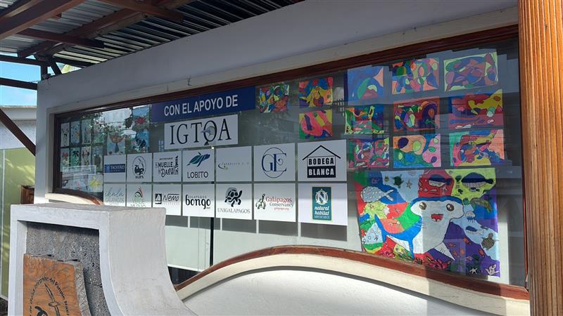 Nat Hab logo on the wall of the Library of the Galapagos